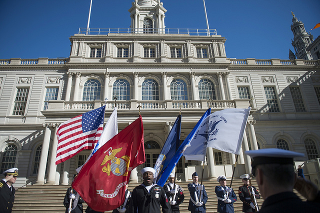 veterans outside city hall flags