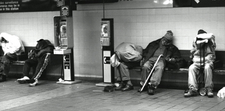 photo of men sleeping on subway platform