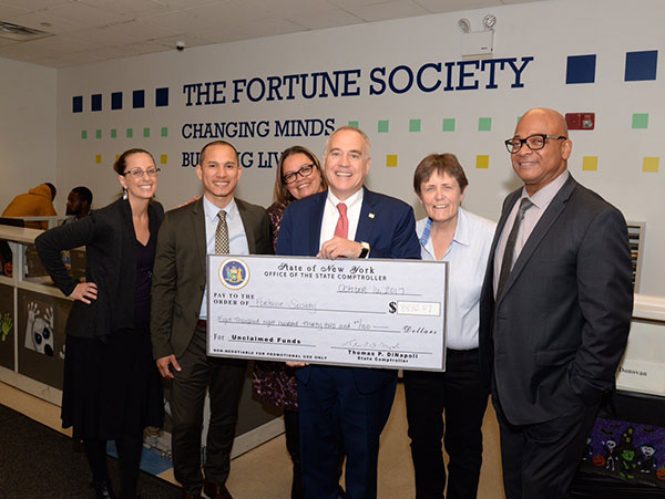 comptroller dinapoli with check nyscomptroller