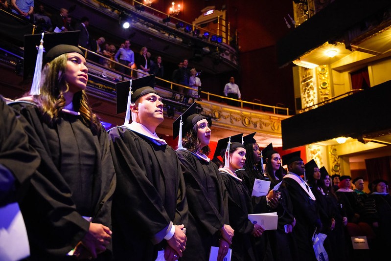 CUNY graduates ceremony caps gowns