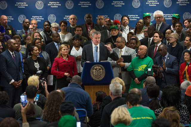 de blasio minimum wage announcement crowd