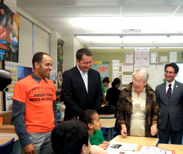 Gonzalez and Farina at a school