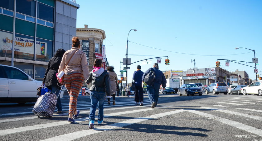 family crossing street