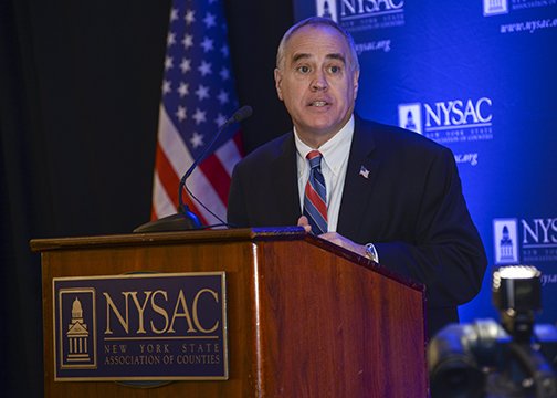 dinapoli speaking podium