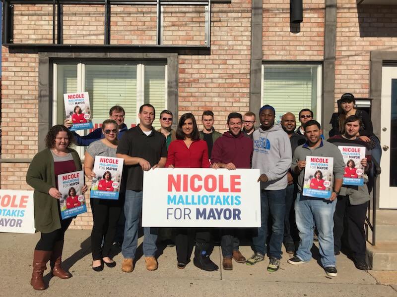 malliotakis with people and banner